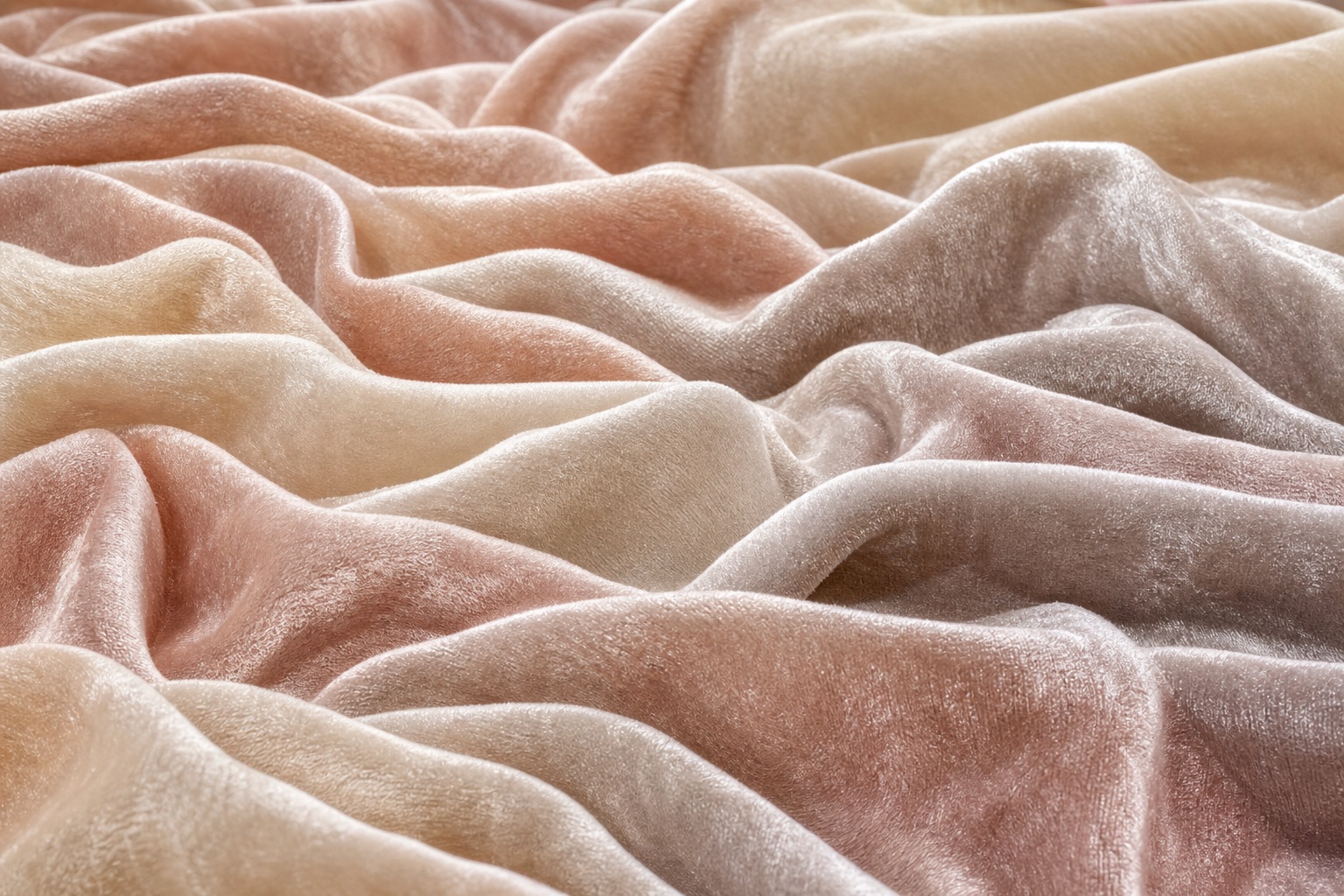 Soft ivory blush velvet fabric folded into gentle ridges and draped waves