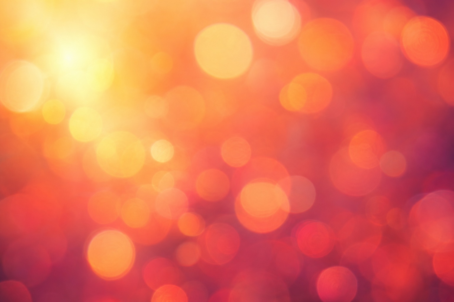 Orange and pink blurred bokeh lights with a soft dreamy glow