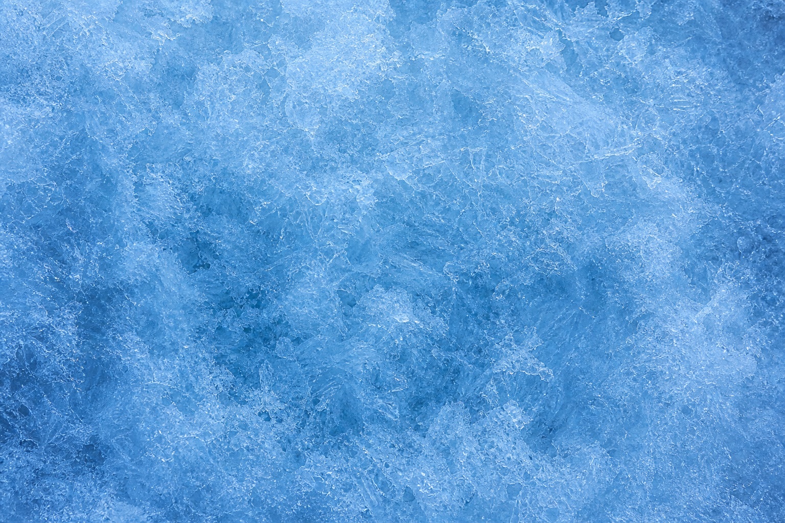 Arctic blue frosted ice surface with soft diffuse clouding and fine frost texture
