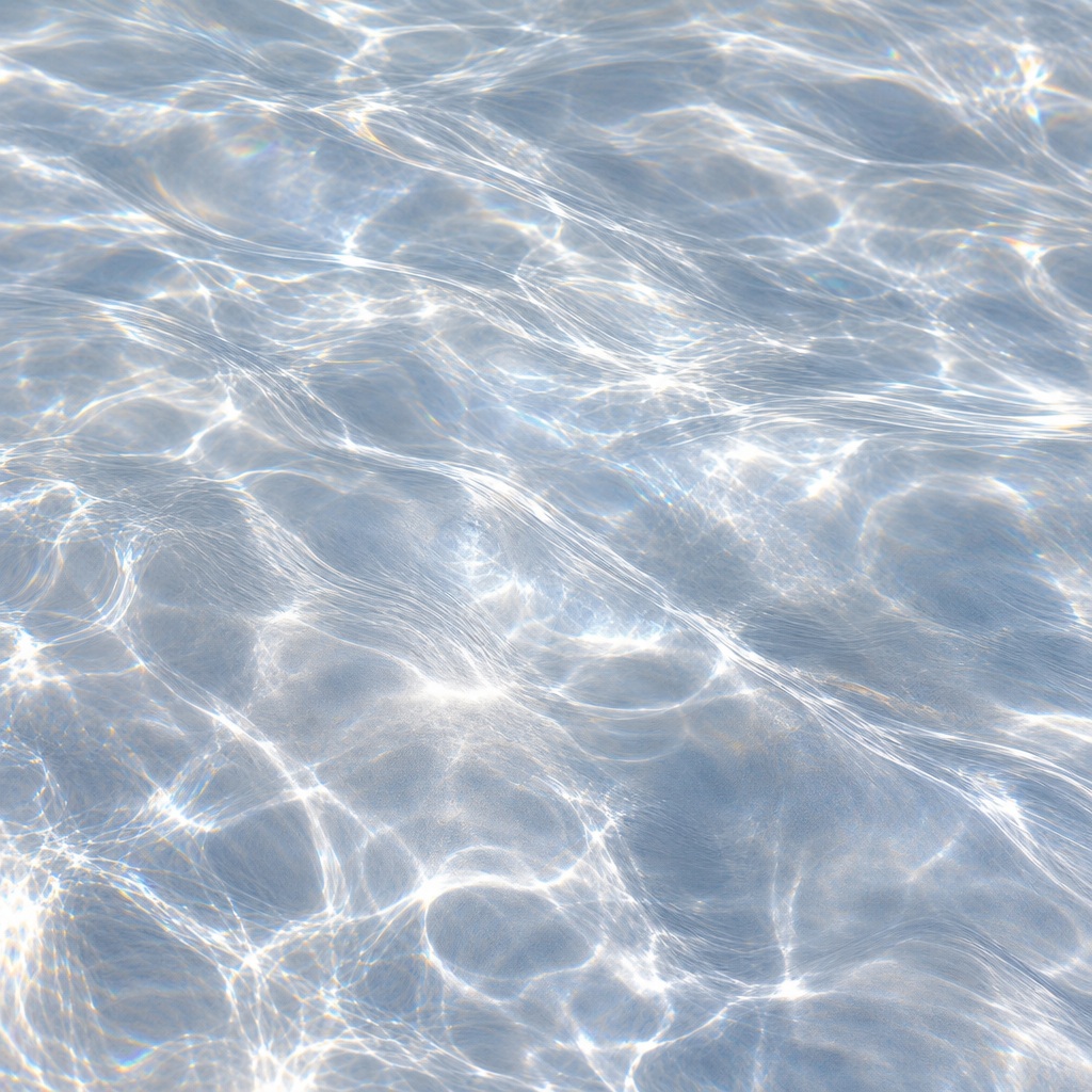 Soft silver white prismatic light reflections forming a rippled abstract background