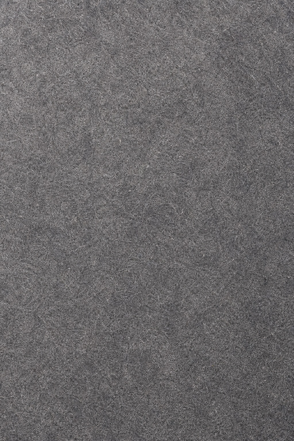 Dark gray paper texture with soft mottled grain and natural fiber look