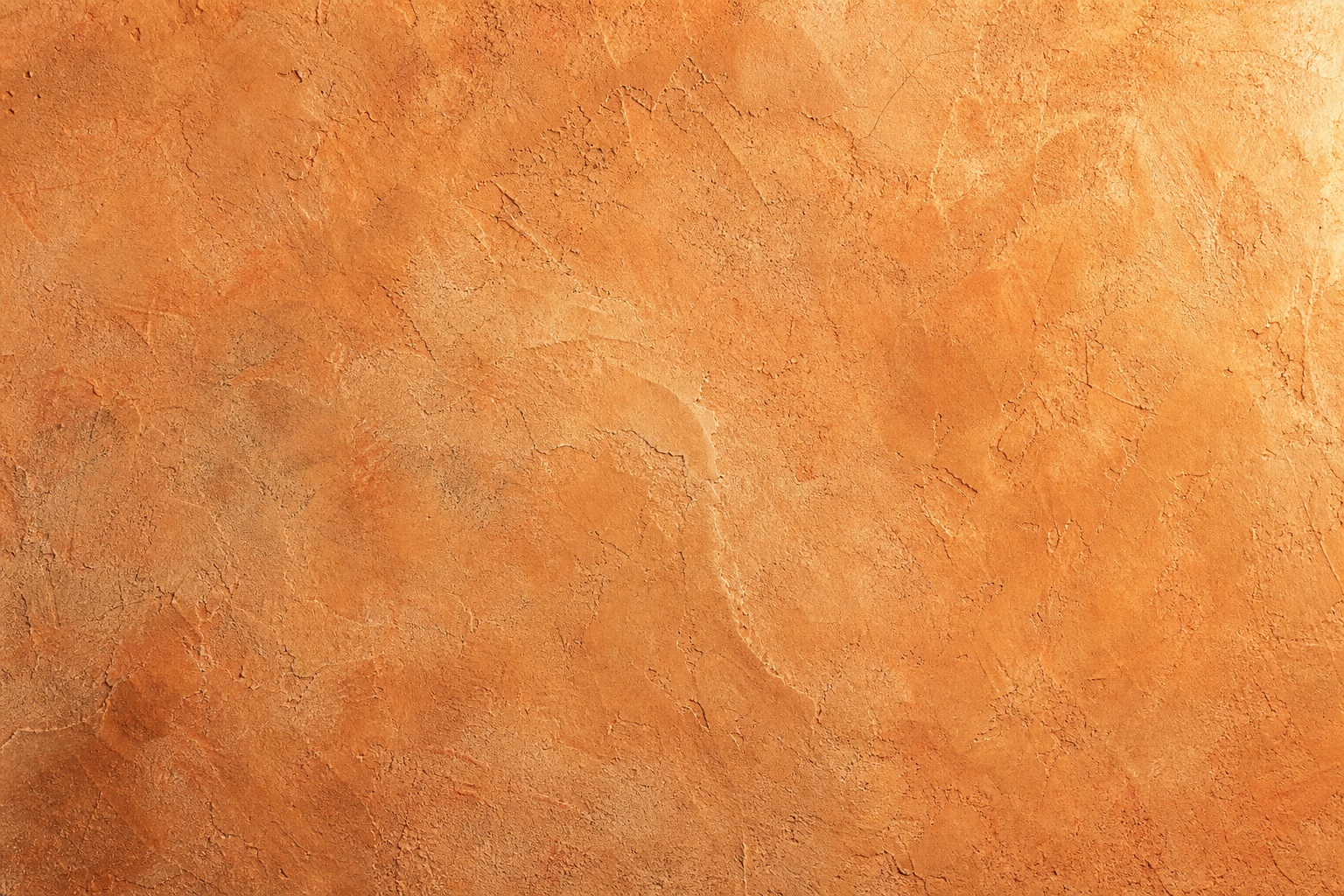 Earthy orange plaster stucco texture with a matte, weathered surface
