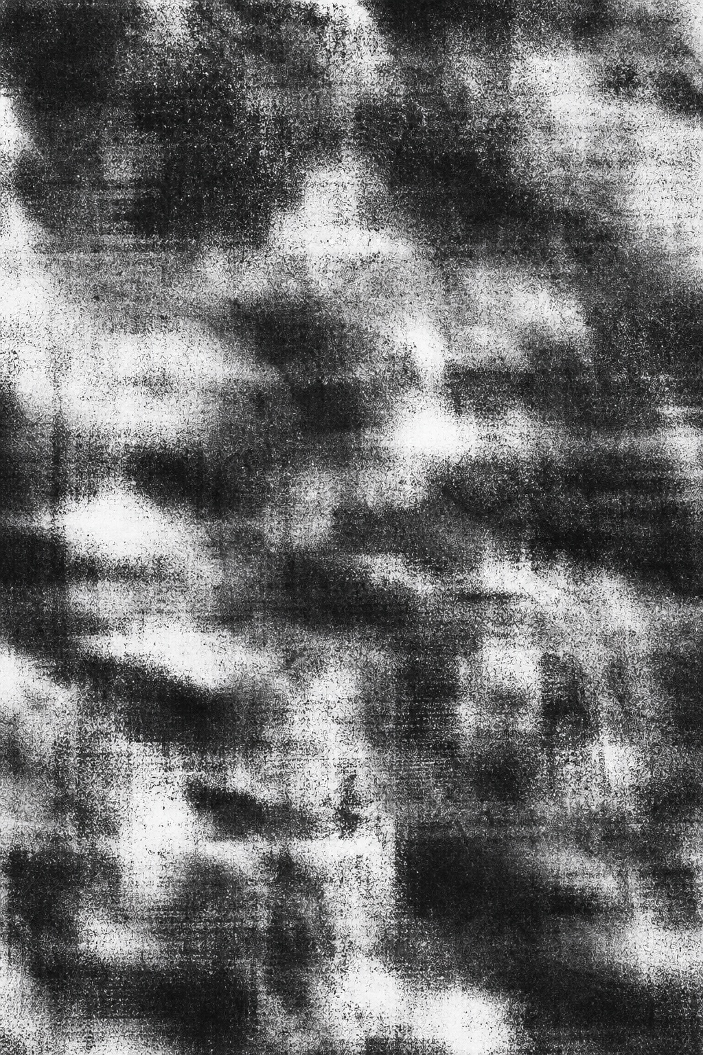 Black and white abstract photocopy texture with dense charcoal-like grain and blurred patches