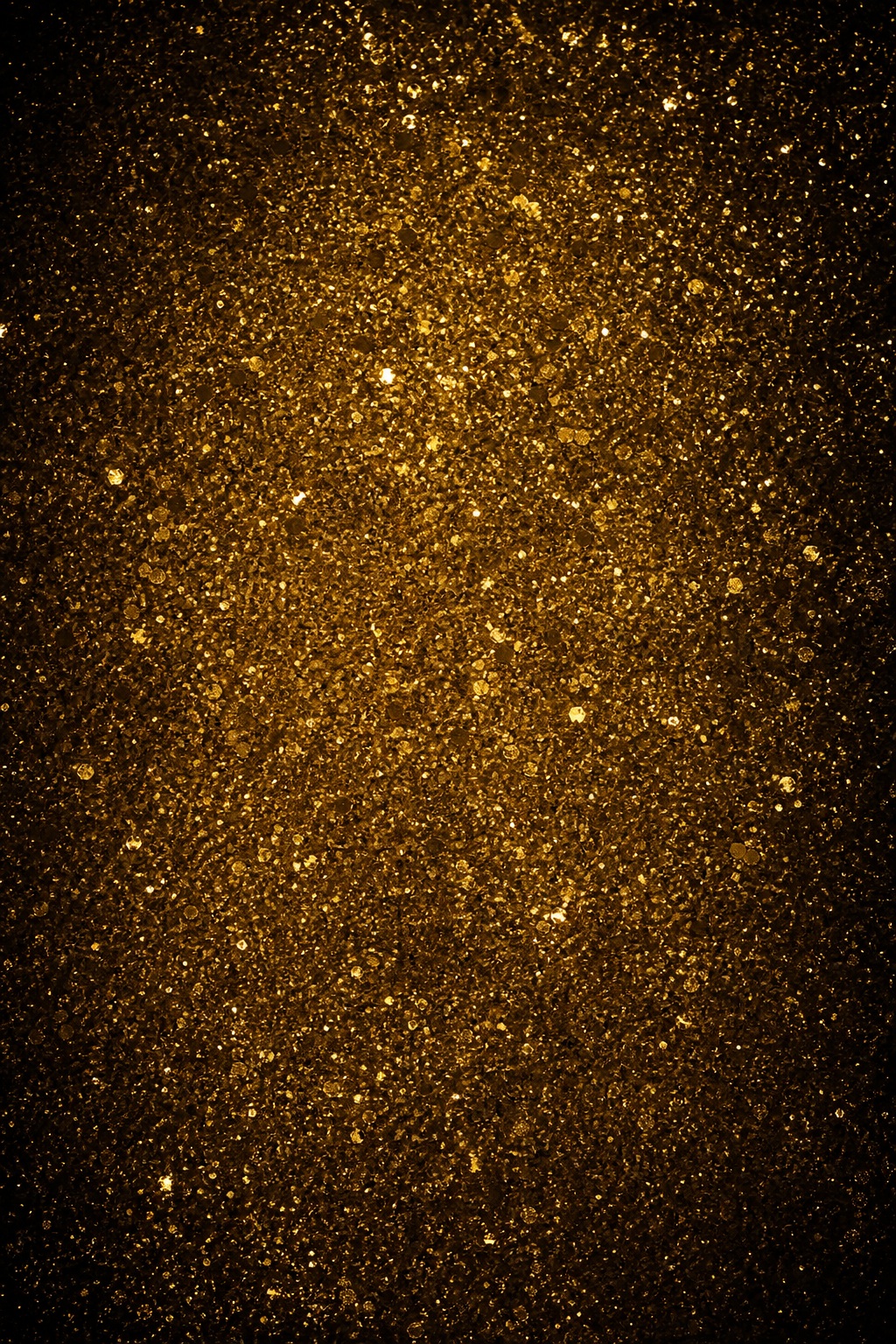 Vertical dark gold glitter texture with bright sparkling specks on a dark background