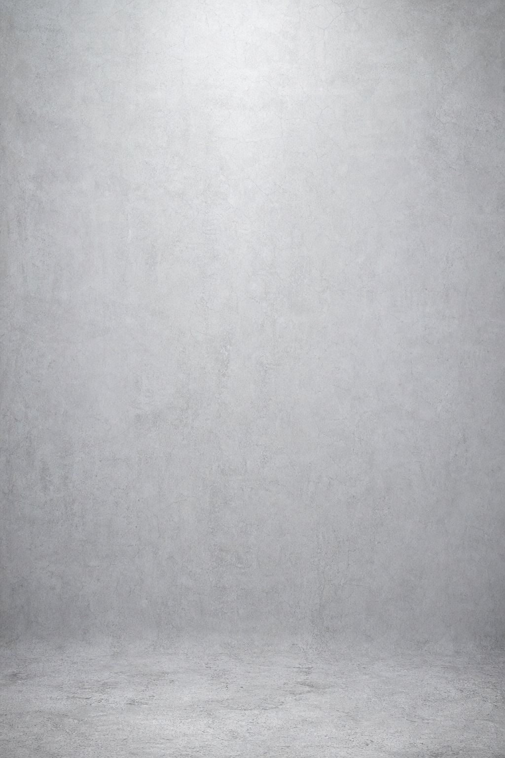 Vertical pale concrete studio backdrop with a soft neutral surface and subtle shadow.