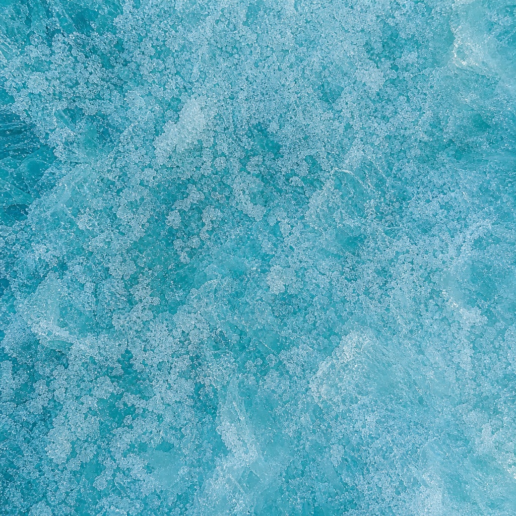 Aqua teal frosted ice texture with a grainy frozen surface pattern.