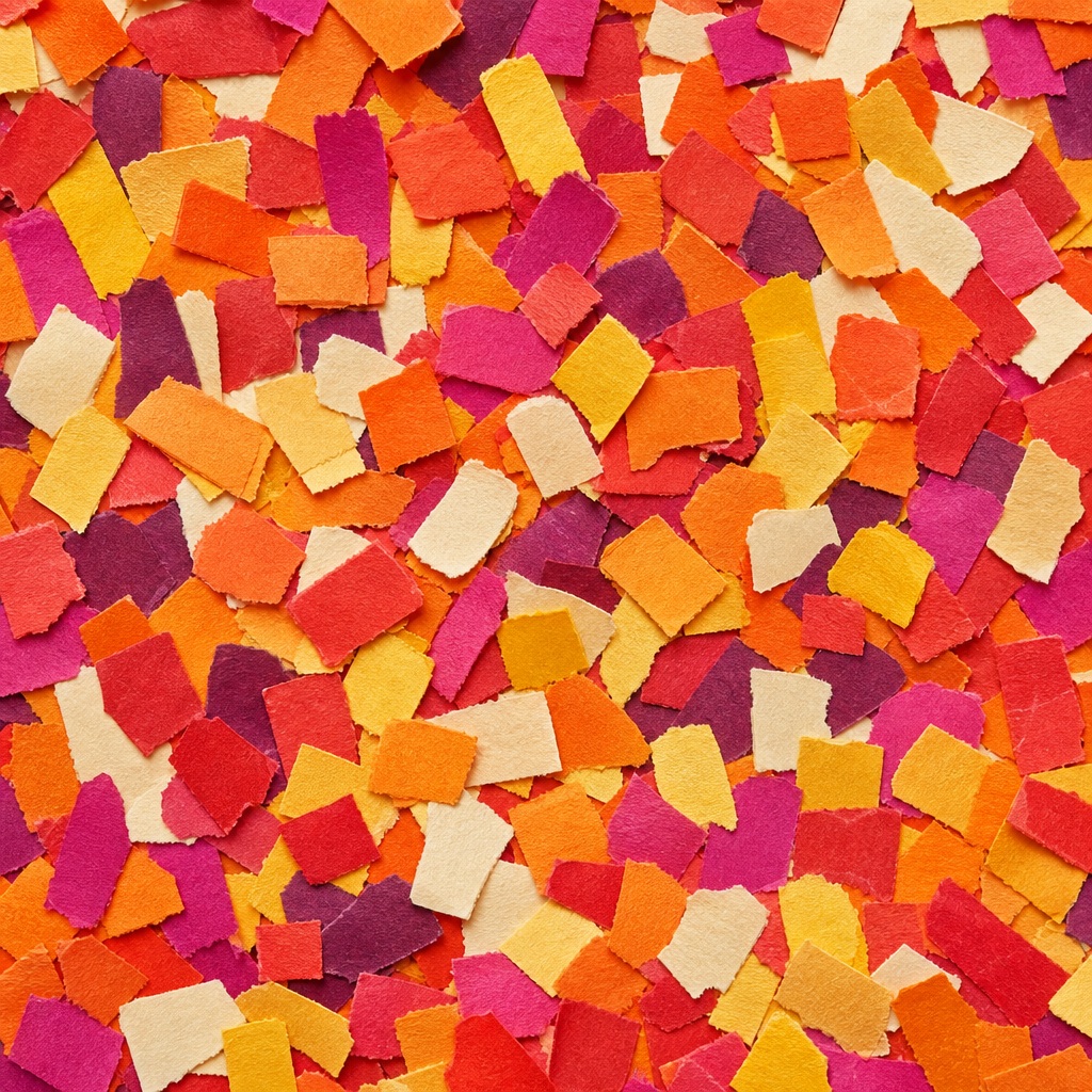 Colorful confetti-like paper dashes scattered across a warm orange background