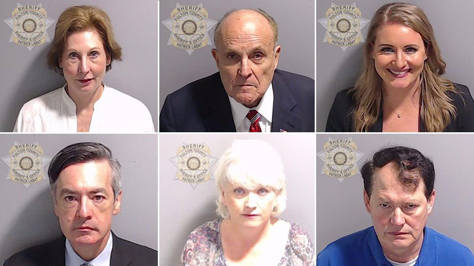 Six mugshot-style portrait photos arranged in a two-by-three grid.