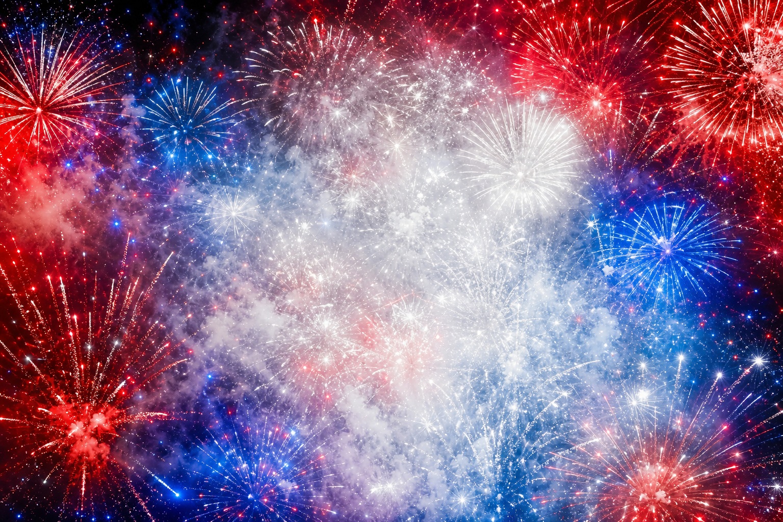 Abstract red, white, and blue fireworks with bright bursts on a dark background