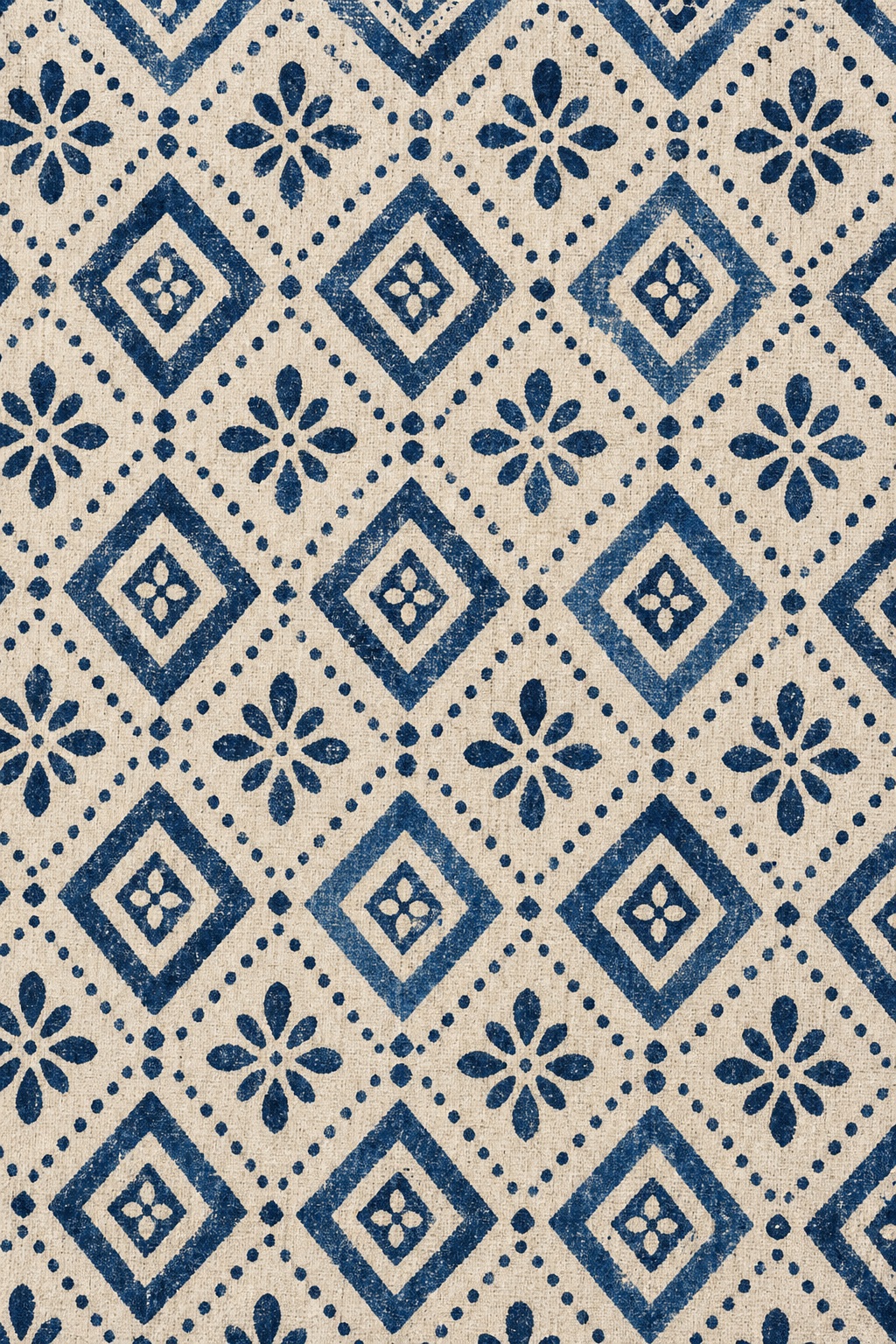 Repeating indigo diamond and floral block print pattern on a light background.