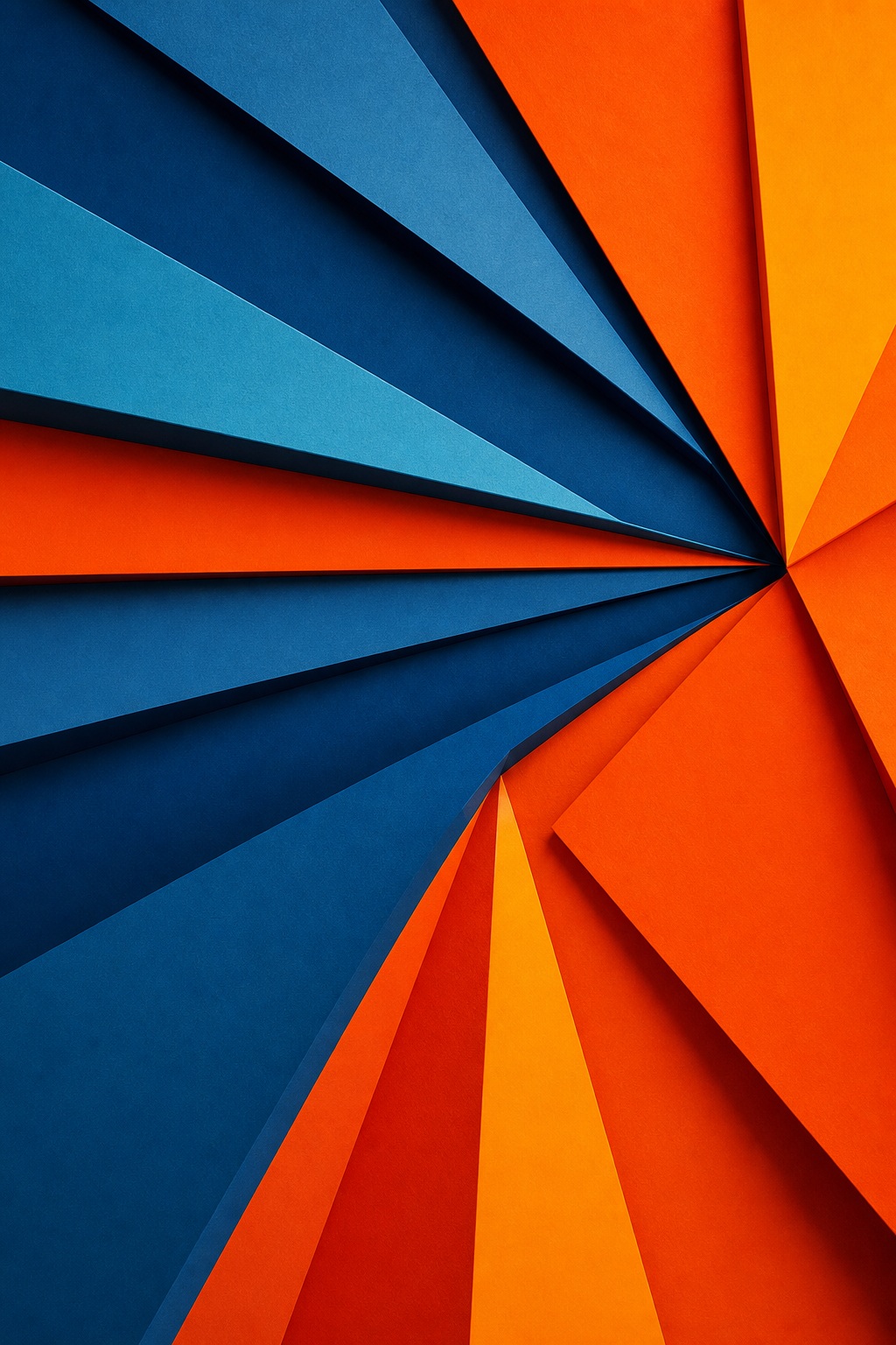 Blue, orange, and red folded paper shapes radiating from one point