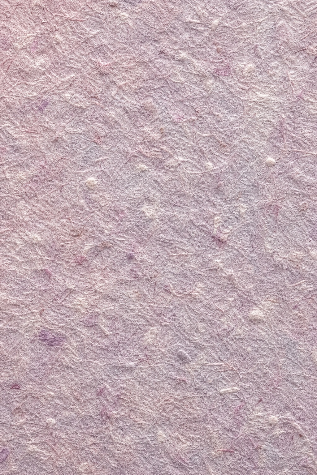 Soft rose lilac handmade paper texture with visible fibers and uneven surface