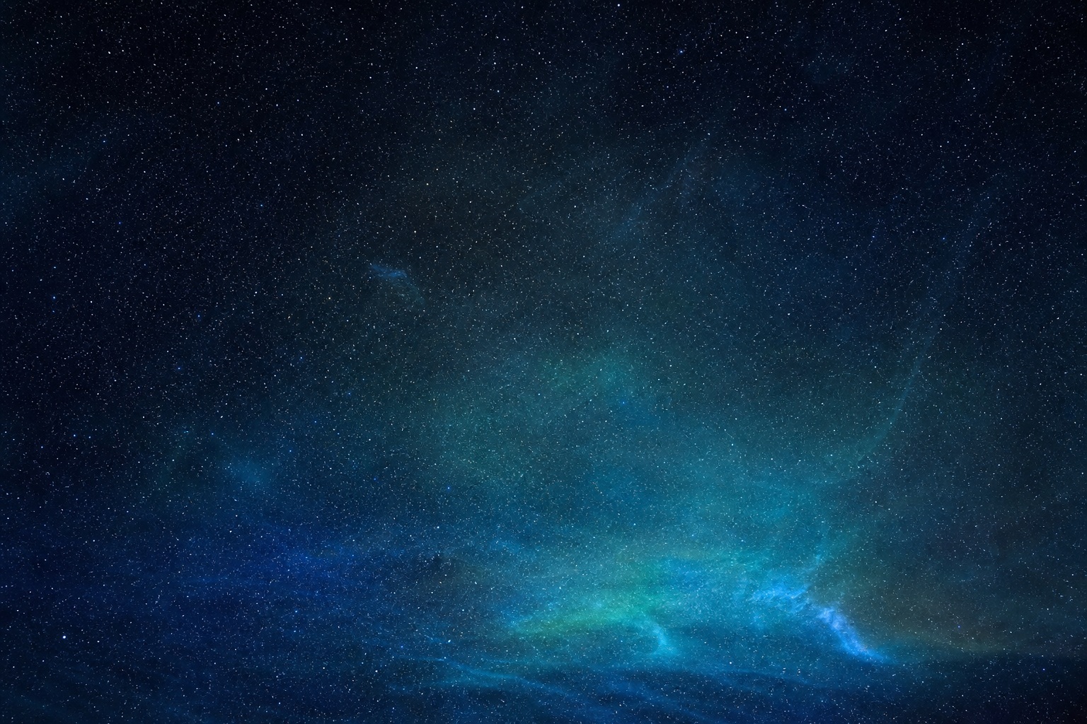 Navy and cyan night sky with star field and glowing haze near the horizon