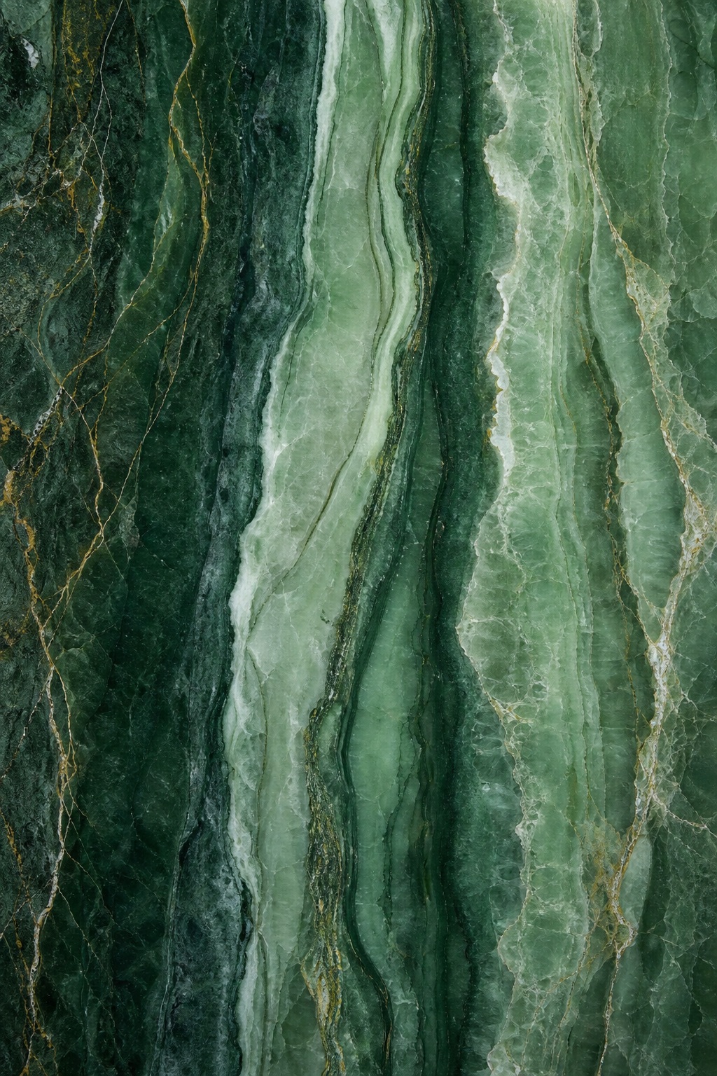 Vertical green marble layers with natural veining and dark stone texture