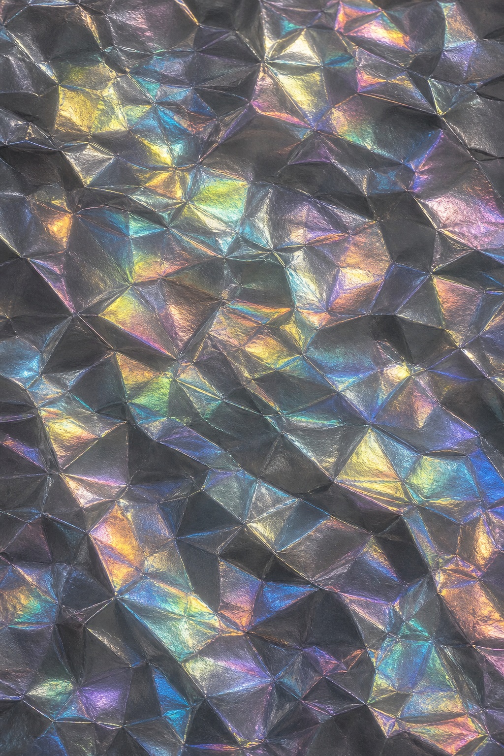 Reflective graphite rainbow foil with crinkled polygonal texture