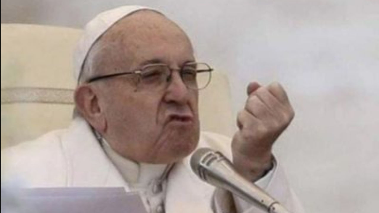 Pope Francis speaking into a microphone