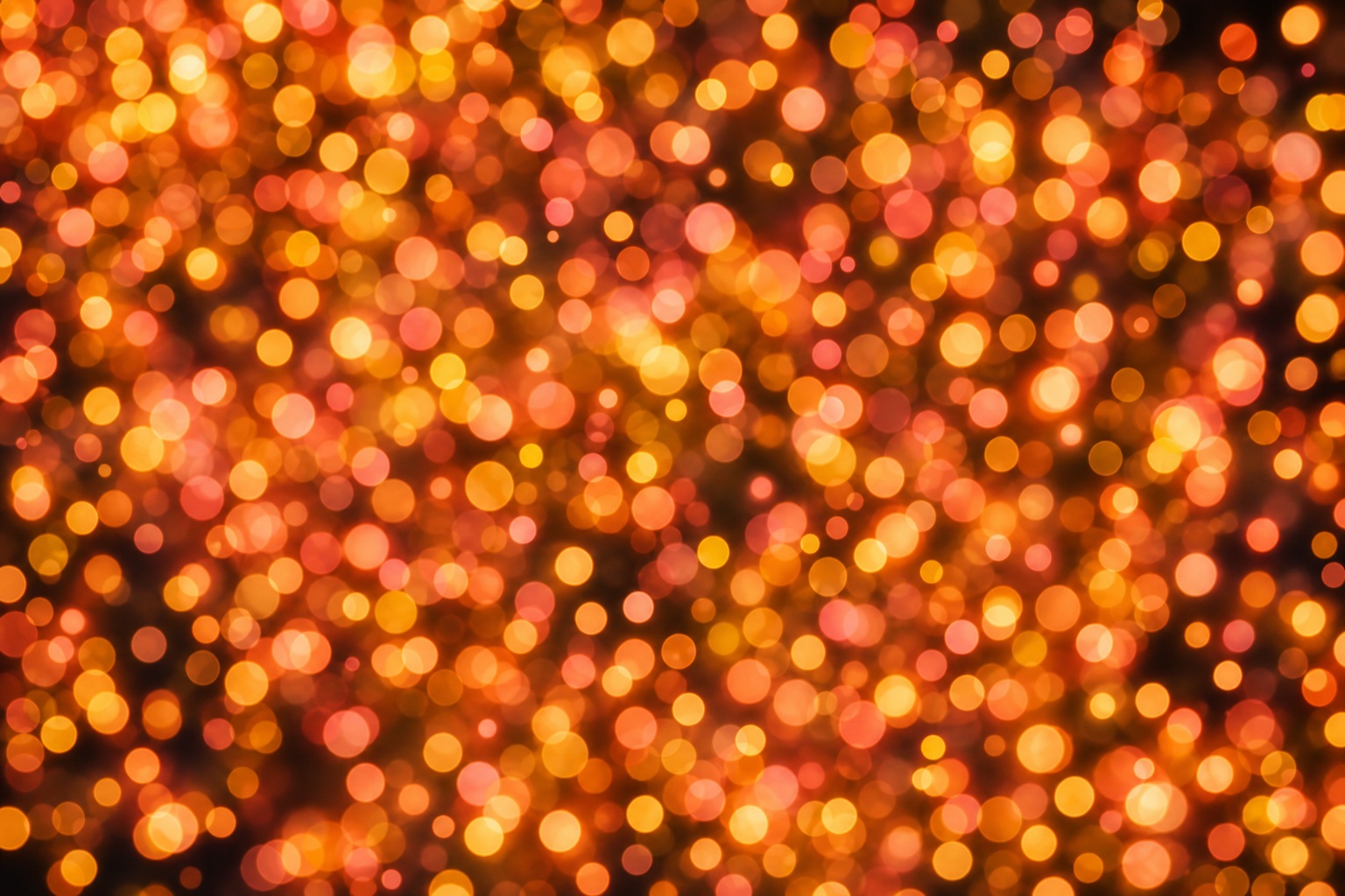 Warm gold and coral bokeh lights with rounded glowing dots on a dark background