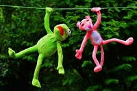 Kermit and Piggy hanging from a wire