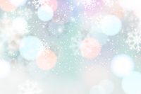 A blurred winter background with pastel bokeh lights and snowflakes.