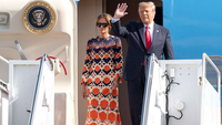 President Trump and First Lady waving while exiting Air Force One