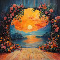 A colorful floral archway over a wooden deck overlooking a serene lake during a vibrant sunset.