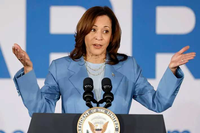 Kamala Harris speaking at a podium
