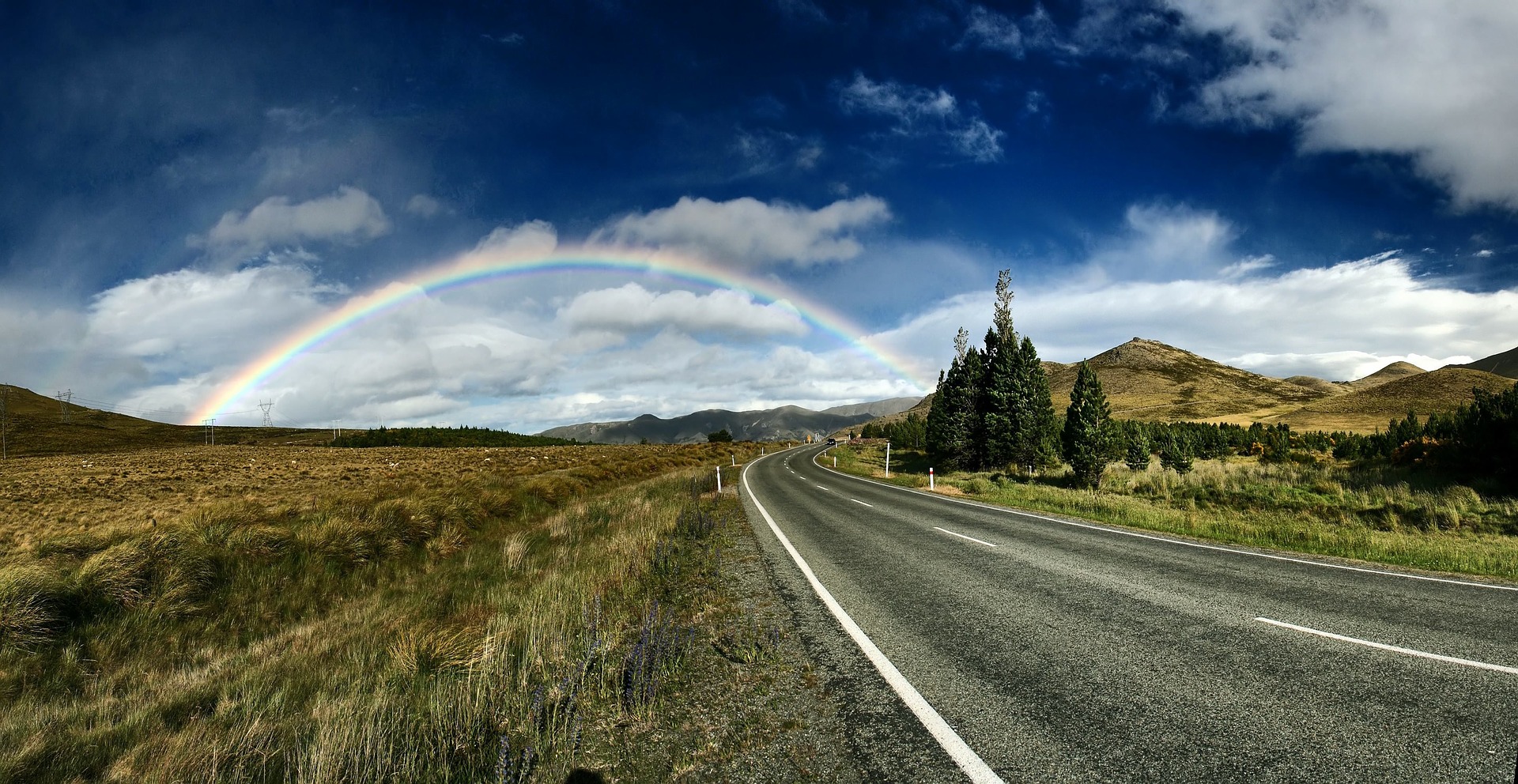 Preview for Rainbow-over-empty-road-highway-background-abc16