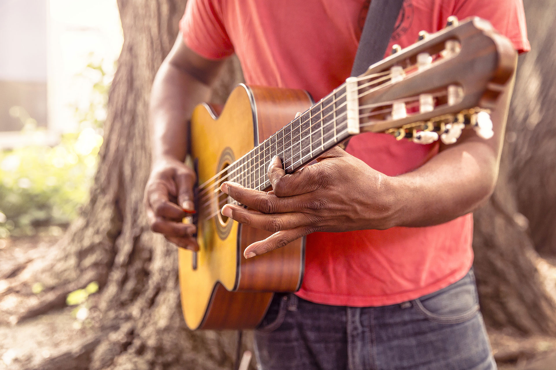 Preview for Man-playing-acoustic-guitar-outdoors-bass-guitar-background-90c0e