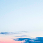 A serene sky with clouds at sunset