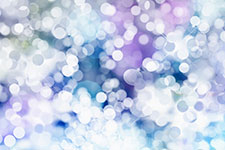 Bokeh light effect background with purple, blue, and white hues