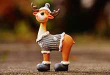 Christmas reindeer figurine with sweater and boots