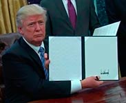 Donald Trump holding a document