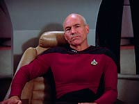 Captain Jean-Luc Picard sitting in his command chair