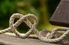 Rope with knots on a wooden surface