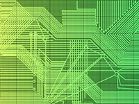 A green circuit board with complex pathways and grid background