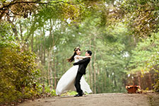 Couple embracing on a forest path